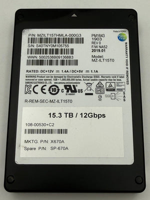 A 16x48mm 12Gbps 15.3TB solid state drive (SSD) with a black plastic casing and a white label containing barcodes and specifications.