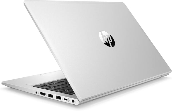 A sleek silver laptop partially open, displaying the HP logo on the back. The laptop's side ports are visible.